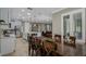 Open-concept living space with kitchen, dining area, and living room at 9405 Bordet Ct, Orlando, FL 32827