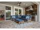 Outdoor kitchen featuring a grill, stainless steel appliances, and a cozy seating area at 9405 Bordet Ct, Orlando, FL 32827