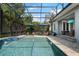 Beautiful screened-in pool area with ample seating and an outdoor entertainment area at 9405 Bordet Ct, Orlando, FL 32827