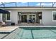 Stunning screened-in pool with an outdoor patio and kitchen providing perfect outdoor living at 9405 Bordet Ct, Orlando, FL 32827