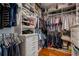 Custom designed walk-in closet with shelving, drawers, and hanging space at 9405 Bordet Ct, Orlando, FL 32827