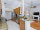 Functional kitchen featuring granite countertops, stainless steel appliances, and ample cabinet space at 115 Oak Grove Cir, Lake Mary, FL 32746