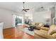 Open-concept living room with sliding glass doors leading to the pool area at 115 Oak Grove Cir, Lake Mary, FL 32746