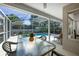 Covered patio view of the screened-in pool area, complete with outdoor seating for relaxation and entertaining at 115 Oak Grove Cir, Lake Mary, FL 32746