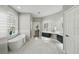 Bathroom featuring double vanities with vessel sinks, free standing tub and walk-in shower at 11508 Delwick Dr, Windermere, FL 34786