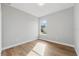 Bright bedroom featuring hardwood floors and a window letting in natural light at 11508 Delwick Dr, Windermere, FL 34786
