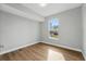 Unfurnished bedroom with hardwood floors, natural light, and neutral color palette and a view of backyard at 11508 Delwick Dr, Windermere, FL 34786