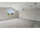 Spacious bonus room with gray carpet and a large window for natural light at 11508 Delwick Dr, Windermere, FL 34786