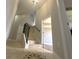 Hallway featuring stairs with tile details and a view of the adjacent living space at 11508 Delwick Dr, Windermere, FL 34786