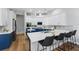 Well-appointed kitchen with island seating, stylish backsplash, modern stainless appliances, and a breakfast nook at 11508 Delwick Dr, Windermere, FL 34786