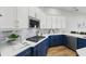 Modern kitchen featuring custom cabinetry, a stylish backsplash, and stainless steel appliances at 11508 Delwick Dr, Windermere, FL 34786