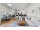 Open-concept living space with dining area, kitchen with breakfast bar, and comfortable seating arrangement at 11508 Delwick Dr, Windermere, FL 34786