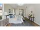 Bright main bedroom featuring stylish rug, bench, and ensuite access at 11508 Delwick Dr, Windermere, FL 34786