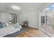 Bright main bedroom with ensuite access, stylish rug, and backyard access at 11508 Delwick Dr, Windermere, FL 34786
