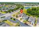 Aerial view of the property showcasing its location in a neighborhood with a nearby lake at 1204 Lexington Ave, Davenport, FL 33837