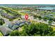 Aerial view of a home featuring a screened-in pool and proximity to a lake at 1204 Lexington Ave, Davenport, FL 33837