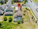 Aerial view of a home with a screened-in pool and fenced yard in a residential neighborhood at 1204 Lexington Ave, Davenport, FL 33837