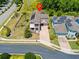 Aerial view of home with solar panels, brick driveway and fenced in yard at 1204 Lexington Ave, Davenport, FL 33837