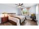 Bedroom features a comfortable bed, wood-look flooring, and a large window at 1204 Lexington Ave, Davenport, FL 33837