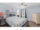 Comfortable bedroom with hardwood flooring, a ceiling fan, and a window with natural light at 1204 Lexington Ave, Davenport, FL 33837