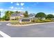Lexington Green community sign featuring lush landscaping and views of neighborhood homes under a bright blue sky at 1204 Lexington Ave, Davenport, FL 33837