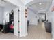 Open hallway with tile floors leading to dining room and office space, showcasing arched entryways at 1204 Lexington Ave, Davenport, FL 33837