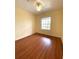 Bedroom features wood-look floors, fresh paint, a ceiling fan, and an abundance of natural light at 1224 S Hiawassee Rd # 638, Orlando, FL 32835