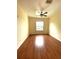 Bedroom features wood-look floors, fresh paint, a ceiling fan, and an abundance of natural light at 1224 S Hiawassee Rd # 638, Orlando, FL 32835