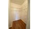 Walk-in closet with built-in wire shelving and wood-look flooring at 1224 S Hiawassee Rd # 638, Orlando, FL 32835