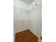 Walk-in closet with built-in wire shelving and wood-look flooring at 1224 S Hiawassee Rd # 638, Orlando, FL 32835