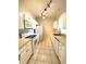 Well-lit kitchen with white appliances, ample cabinet space, and neutral tile flooring at 1224 S Hiawassee Rd # 638, Orlando, FL 32835