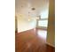 Bright living room features wood-look floors, fresh paint, a ceiling fan, and an abundance of natural light at 1224 S Hiawassee Rd # 638, Orlando, FL 32835