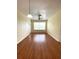 Bright living room features wood-look floors, fresh paint, a ceiling fan, and an abundance of natural light at 1224 S Hiawassee Rd # 638, Orlando, FL 32835