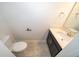 Bathroom features a sleek vanity with a modern sink, toilet, and elegant fixtures at 1227 Sandwedge St, Davenport, FL 33896