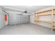 Spacious garage with workbench and garage door at 1227 Sandwedge St, Davenport, FL 33896