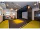 Golf simulator room with chairs, a small table, and turf on the ground at 1227 Sandwedge St, Davenport, FL 33896