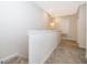 Bright upstairs hallway with carpeted floors and white trim at 1227 Sandwedge St, Davenport, FL 33896