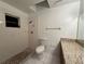 Bathroom with tiled shower, granite countertop, and white fixtures at 12512 Wisconsin Woods Ln, Orlando, FL 32824