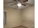 Bedroom featuring a ceiling fan and a window at 12512 Wisconsin Woods Ln, Orlando, FL 32824