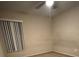 Bedroom with light-colored walls, a ceiling fan, and a window with blinds at 12512 Wisconsin Woods Ln, Orlando, FL 32824