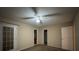 Bedroom features a ceiling fan and door leading to outside at 12512 Wisconsin Woods Ln, Orlando, FL 32824