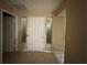 Entryway with a white front door flanked by side windows at 12512 Wisconsin Woods Ln, Orlando, FL 32824