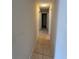 Hallway with tile floor leading to the rooms of the house at 12512 Wisconsin Woods Ln, Orlando, FL 32824