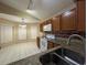 The bright kitchen features wood cabinets, granite countertops, and a breakfast nook at 12512 Wisconsin Woods Ln, Orlando, FL 32824