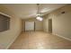 Spacious living room features neutral paint and tile flooring at 12512 Wisconsin Woods Ln, Orlando, FL 32824