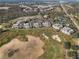 A beautiful aerial view of the community and golf course in the distance at 1370 Centre Court Ridge Dr # 204, Reunion, FL 34747