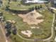 Aerial shot showcasing the beautiful golf course featuring sand traps and a green field at 1370 Centre Court Ridge Dr # 204, Reunion, FL 34747