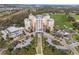 A lovely aerial view of a resort including the hotel, greens, and beautifully manicured landscaping at 1370 Centre Court Ridge Dr # 204, Reunion, FL 34747