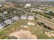 Overhead view of the property and golf course, showcasing the condo buildings and surrounding community at 1370 Centre Court Ridge Dr # 204, Reunion, FL 34747