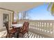 Balcony with outdoor seating and a table overlooking the golf course with manicured greens at 1370 Centre Court Ridge Dr # 204, Reunion, FL 34747